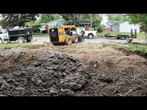 How to remove a concrete driveway with a skid steer concrete 